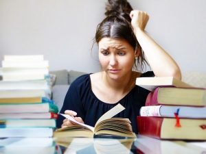 Stressed woman reading a book