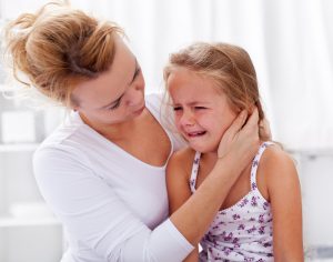 homeschool mom comforting crying child