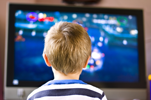 Kid watching TV instead of reading books