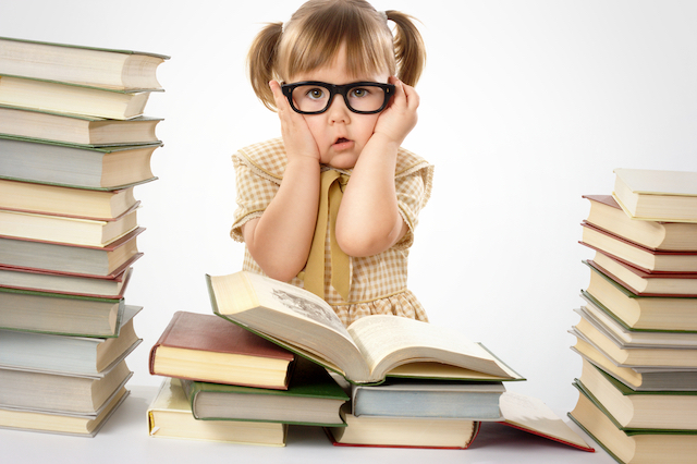 Little girl being taught too early to read