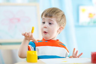 homeschool kindergarten boy with paint