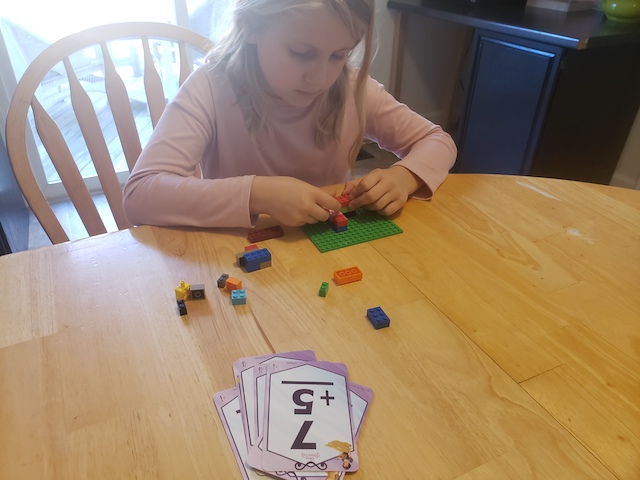 Kid playing Build a Tower Flashcard Game