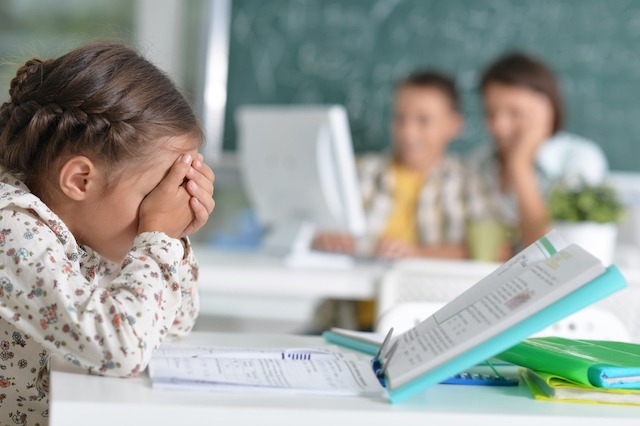 frustrated kid in public school classroom